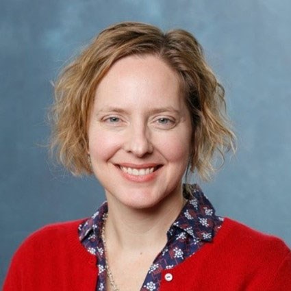 A headshot of Shanna Smith Jaggars wearing a red cardigan
