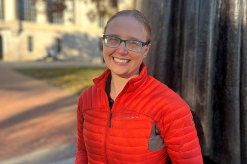 Carolyn Johns wearing a red jacket