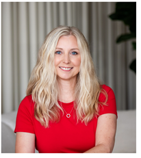 Donna's headshot wearing a bright red shirt.