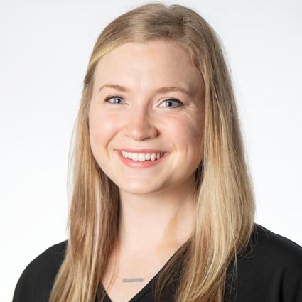 Headshot of Chrisse Edmunds wearing a black blouse.